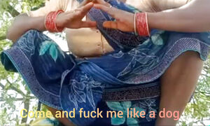 Asking Pleasure Outdoor In The Farm Sitting Wearing Saree .